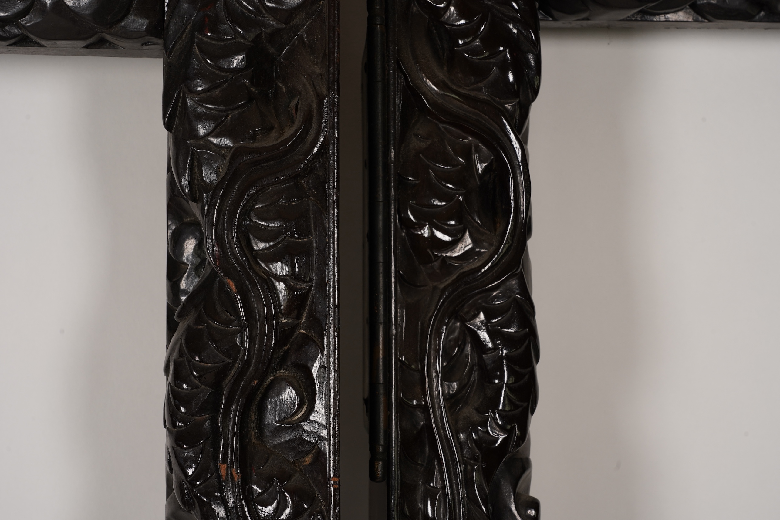 A pair of large Japanese carved hardwood ’dragon’ screen frames, Meiji period